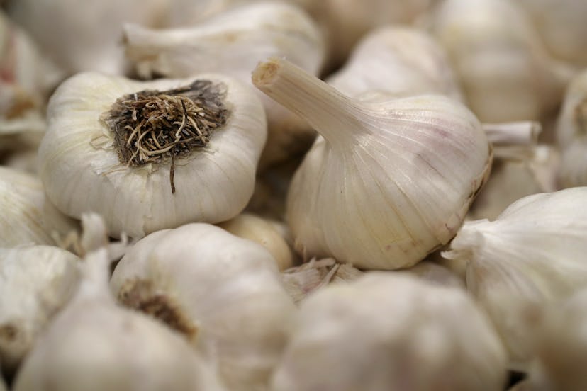 A pile of garlic bulbs stacked on top of each other