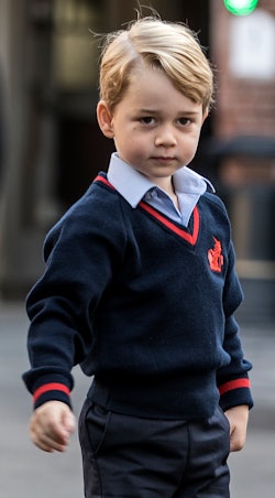 Kate Middleton's son, Prince George in a navy sweater, blue shirt and black pants who had a low-key ...
