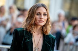 Olivia Palermo in a green velvet blazer at a red carpet 