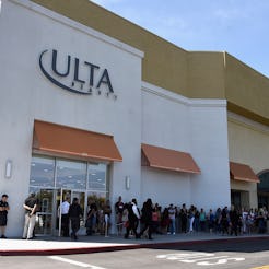 A long queue of people waiting to get into Ulta store during the 21 Days Of Beauty Sale starting on ...