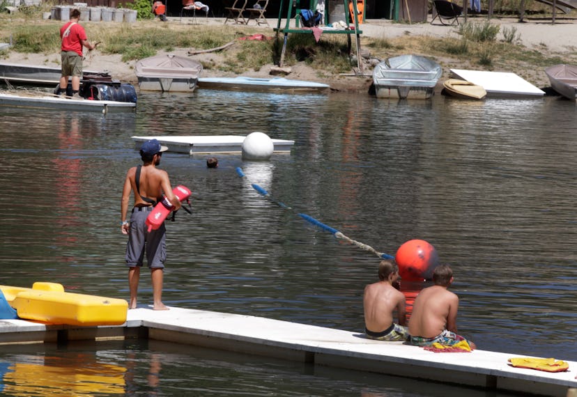 PAYSON, UT - JULY 31: Boy Scouts swim in a lake at camp Maple Dell on July 31, 2015 outside Payson, ...