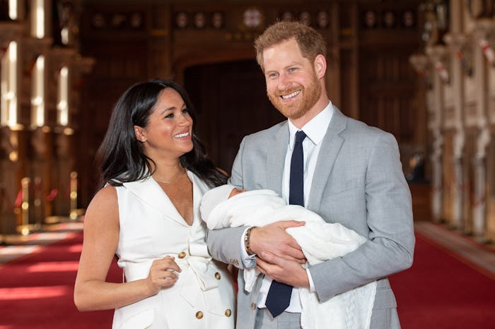 WINDSOR, ENGLAND - MAY 08: Prince Harry, Duke of Sussex and Meghan, Duchess of Sussex, pose with the...