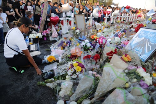 EL PASO, TEXAS - AUGUST 06: People gather at a makeshift memorial honoring victims outside Walmart, ...