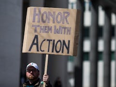 WASHINGTON, DC - MARCH 24: A demonstrator holds a sign the March for Our Lives rally March 24, 2018 ...