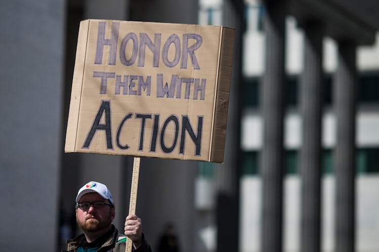 WASHINGTON, DC - MARCH 24: A demonstrator holds a sign the March for Our Lives rally March 24, 2018 ...