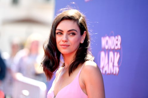 Mila Kunis in a pink dress at a wonder park red carpet event