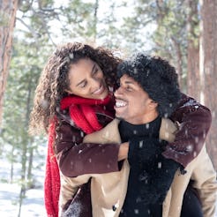 A couple play in snow. Winter may represent a downturn in libido for many people because of various ...