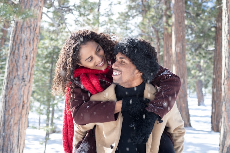 A couple play in snow. Winter may represent a downturn in libido for many people because of various ...