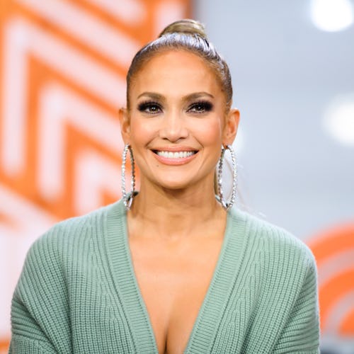 Jennifer Lopez smiling with her well cared face skin as the highlight