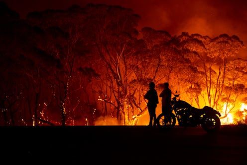 Onlookers watch Australian bushfires. The fires of the 2019-20 fire season have been the most destru...