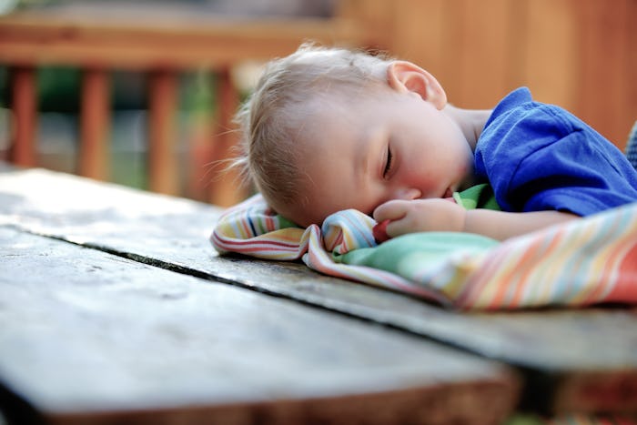 toddler sleeping with head on table