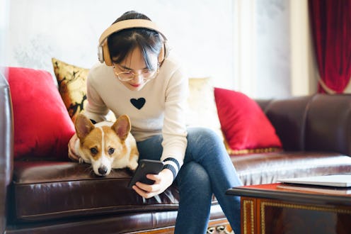 A person hugs her dog while listening to music. Listening to music with your pet is about to get muc...