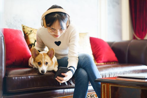 A person hugs her dog while listening to music. Listening to music with your pet is about to get muc...