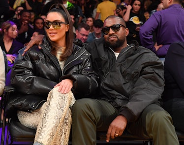 Kim Kardashian and Kanye West attend a Lakers game.