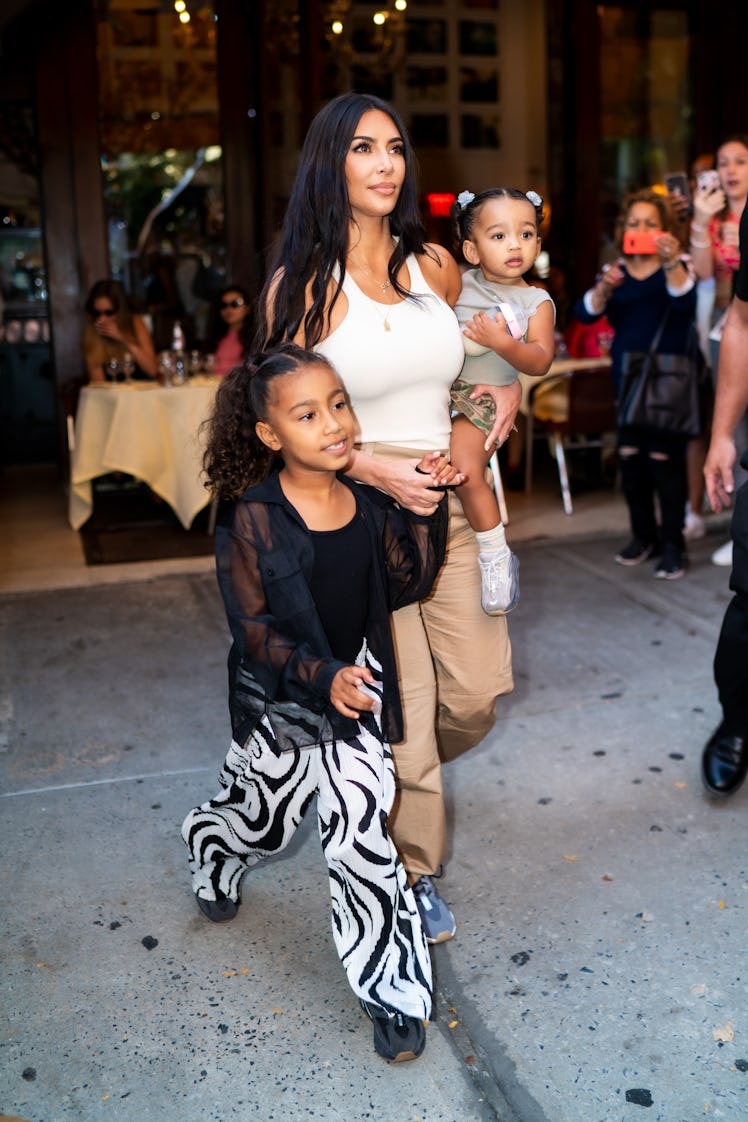 Kim Kardashian steps out with Chicago and North West.