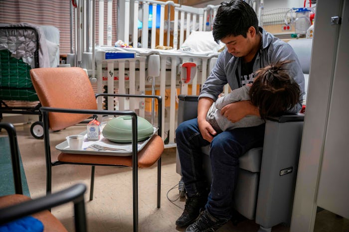 dad with kid in pediatric intensive care unit (PICU)