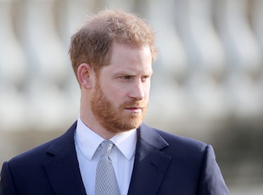 Prince Harry steps out in a navy blue suit.