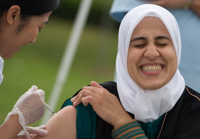 a woman getting her flu shot