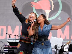 Raven Symone and Adrienne Bailon perform at the Women's March 