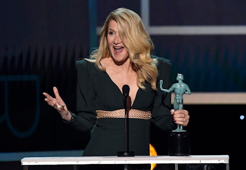 Laura Dern recieving and celebrating her SAG award in a green evening dress