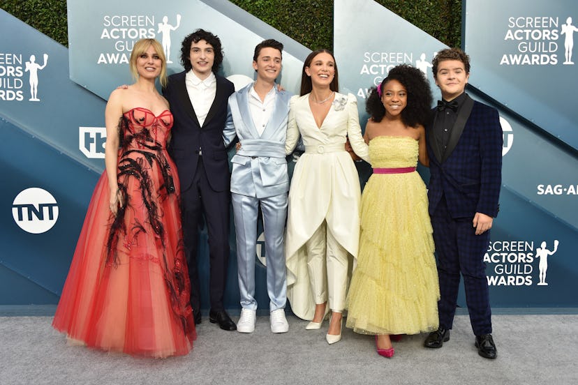 Millie Bobby Brown poses alongside some of her "Stranger Things" co-stars at the 2020 SAG Awards on ...