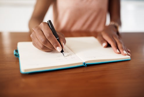 A woman works on her to-do list. These unconventional productivity hacks can help you get your work ...