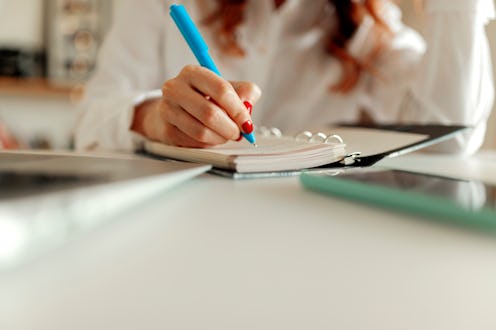 A woman writes in a journal. Finishing a job on a to-do list might seem like an achievement- but som...