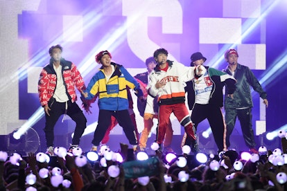 BTS perform live in concert.