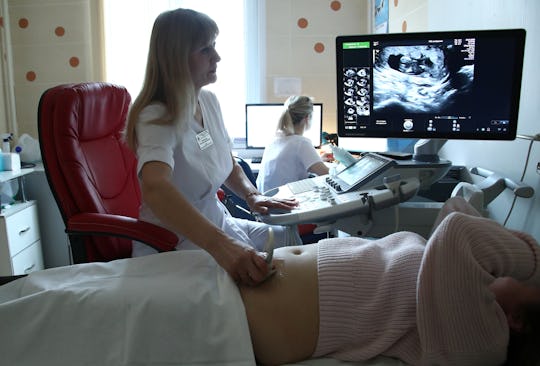 a pregnant woman getting an ultrasound