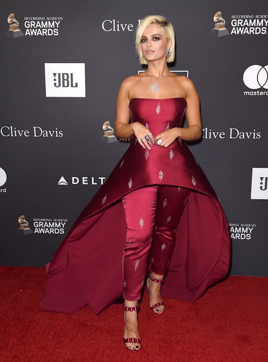 Bebe Rexha posing in a burgundy gown