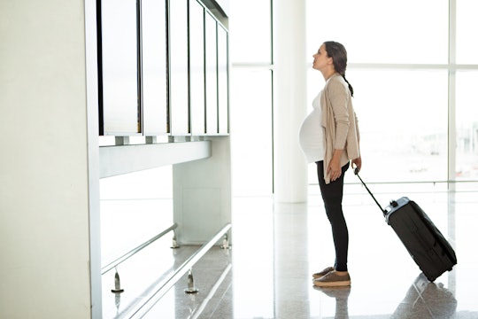 pregnant woman at airport