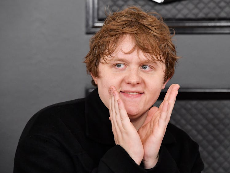 Lewis Capaldi poses on the red carpet at the 62nd annual Grammy Awards.