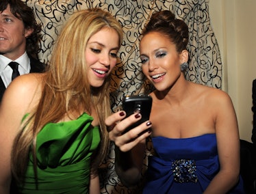 The 2020 Super Bowl halftime show performers, Shakira and Jennifer Lopez, are looking at J.Lo's phon...