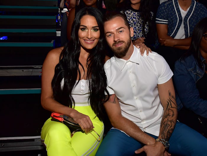 Nikki Bella and Artem Chigvintsev used a sonogram photo to announce that Nikki and twin sister Brie ...