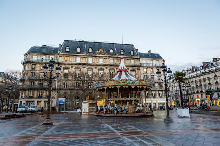 Hotel de Ville in Paris has beautiful balconies and architectural design, and a carousel outside tha...