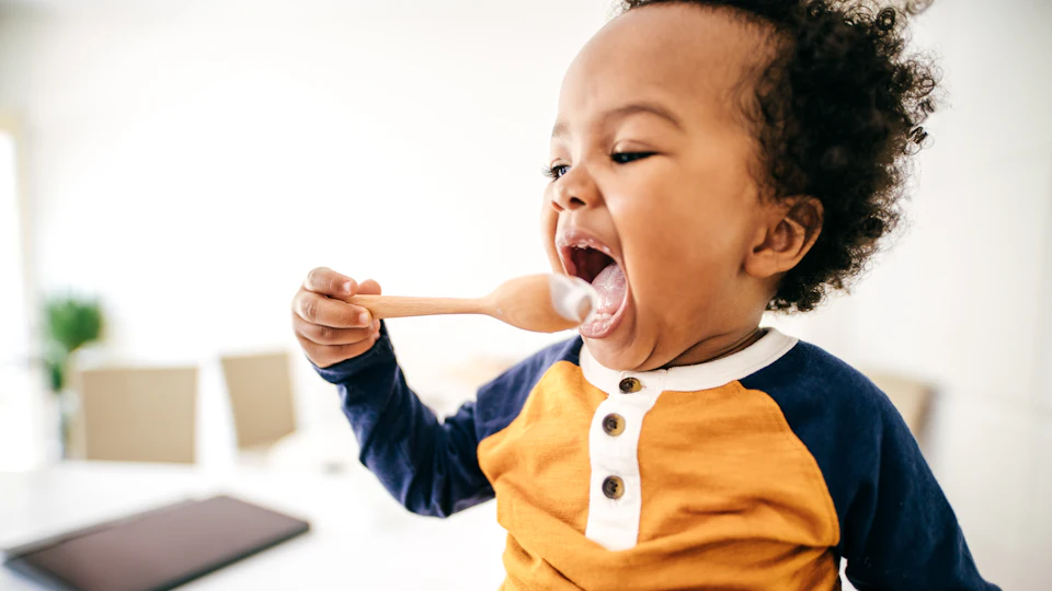 12 Pictures Of Babies Learning To Use Spoons & Looking *So* Cute