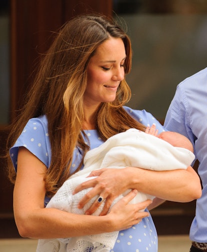 New mom Middleton holds Prince George outside of the Lindo Wing