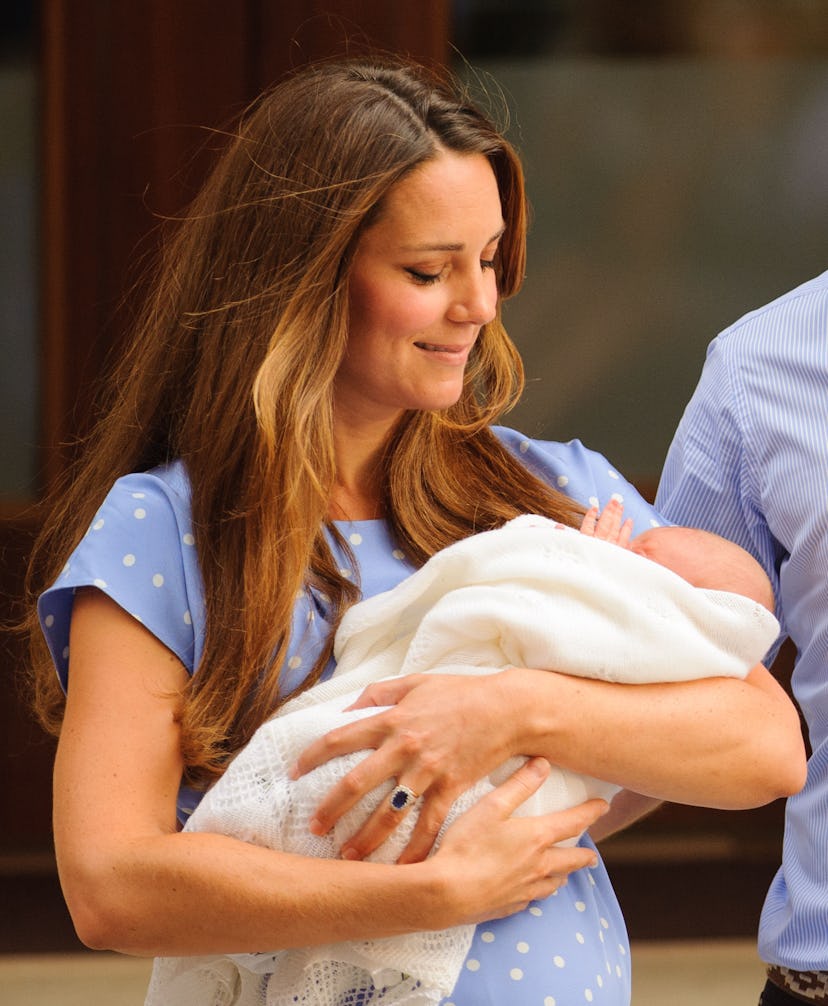 New mom Middleton holds Prince George outside of the Lindo Wing