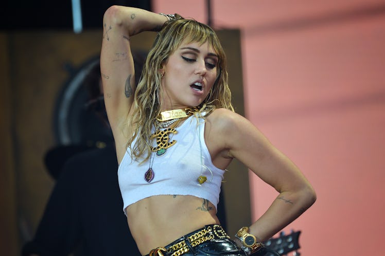 Miley Cyrus rocks out on stage.