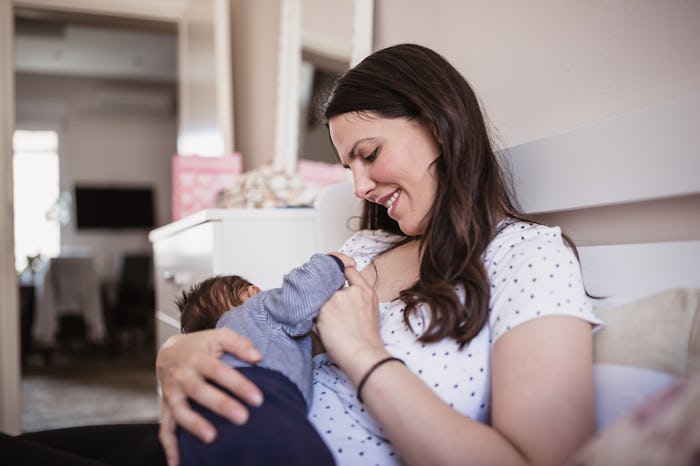 mom breastfeeding newborn
