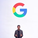 Google CEO Sundar Pichai in front of the Google "G" letter.