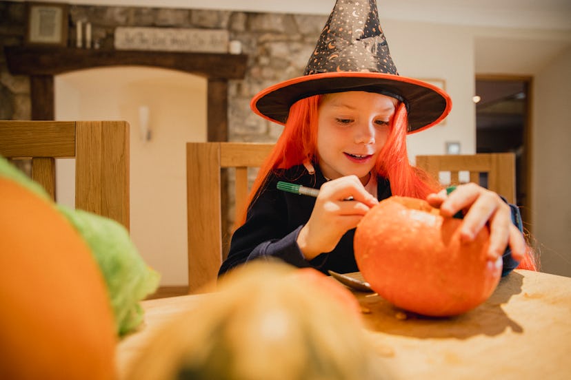 Carving or decorating pumpkins are Halloween activities to do if you're not trick-or-treating.