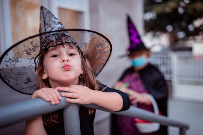 little girl in witch hat