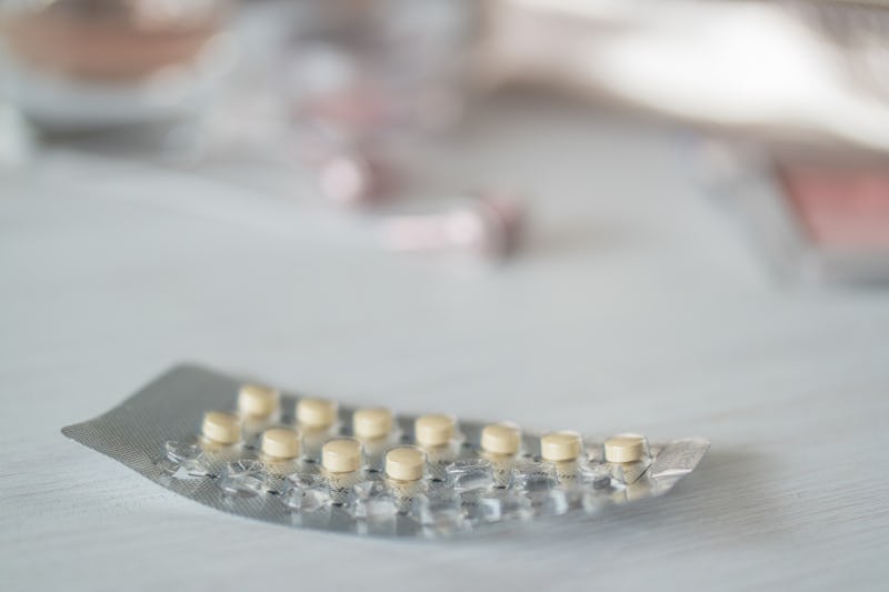 A half empty birth control pill pack on a marble table. Doctors debunk myths about birth control and...