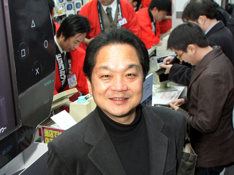 A smiling Ken Kutaragi of PlayStation is seen among other people. 