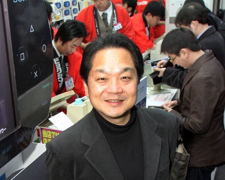 A smiling Ken Kutaragi of PlayStation is seen among other people. 