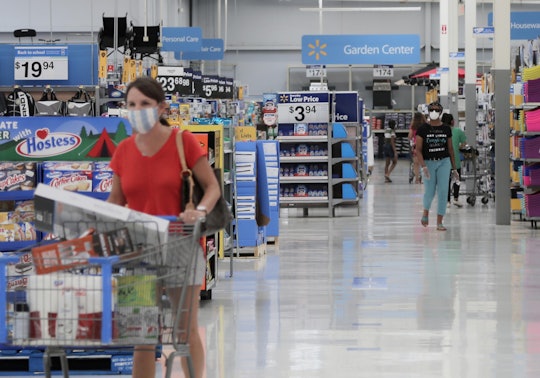 people shopping in face masks at walmart