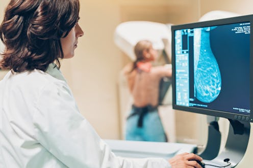 A doctor looks at a mammogram. Some breast cancers, like triple negative breast cancers, develop muc...