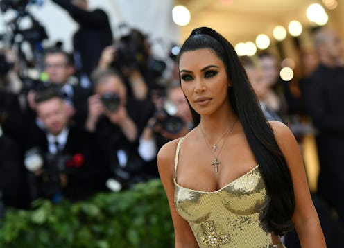 Kim Kardashian's signature beauty look includes smokey eyes and a nude lip