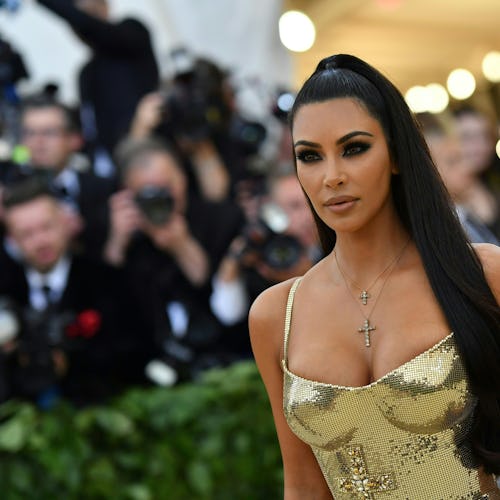 Kim Kardashian's signature beauty look includes smokey eyes and a nude lip